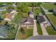 Aerial view of the home and its large, fenced backyard, complemented by the detached garage at 1225 Wild Daisy Dr, Plant City, FL 33563