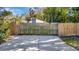 View of fenced backyard with a concrete pad at 1231 Country Club N Rd, St Petersburg, FL 33710