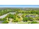 Beautiful residence features a spacious lawn, circular driveway, and serene landscaping, ideal for peaceful living at 13206 Lewis Raulerson Road, Dover, FL 33527