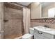 Traditional bathroom featuring tiled walls and floors and shower at 13206 Lewis Raulerson Road, Dover, FL 33527