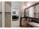 Elegant bathroom with double sinks, marble countertops, and decorative tile, seen through an open doorway at 13206 Lewis Raulerson Road, Dover, FL 33527