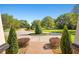 Landscaped front yard and circular driveway leading to a stately home at 13206 Lewis Raulerson Road, Dover, FL 33527
