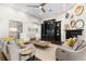 Bright living room showcasing a fireplace, elegant furnishings, and a cozy ambiance, ideal for Gathering gatherings and entertaining at 13206 Lewis Raulerson Road, Dover, FL 33527