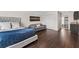 Stylish main bedroom with hardwood floors, sitting area, closet and ensuite bathroom with granite countertops at 13206 Lewis Raulerson Road, Dover, FL 33527