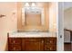 Well-lit bathroom featuring a granite countertop vanity and a decorative mirror at 1331 Abbey Crescent Ln, Clearwater, FL 33759