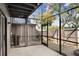 Relaxing screened-in patio with lighting, offering a seamless transition to the outdoors with a fenced backyard at 1331 Abbey Crescent Ln, Clearwater, FL 33759