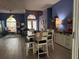 Open-concept dining room with natural light, stylish furniture, and modern finishes at 2069 Overbrook Ln, Spring Hill, FL 34606