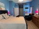 Cozy bedroom featuring laminate flooring, a comfy bed, a ceiling fan, and neutral paint at 2069 Overbrook Ln, Spring Hill, FL 34606