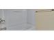 Bright white tub and shower combination with chrome fixtures and towel bar at 2128 River Turia Cir # 2128, Riverview, FL 33578