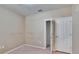 Simple bedroom with neutral walls, carpet, and closet; ready for personalization at 2128 River Turia Cir # 2128, Riverview, FL 33578