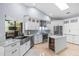 Bright modern kitchen with stainless steel appliances, marble countertops at 2136 Pinnacle N Cir, Palm Harbor, FL 34684