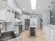 Bright, modern kitchen with stainless steel appliances, wine cooler at 2136 Pinnacle N Cir, Palm Harbor, FL 34684