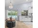 Eat-in kitchen features an island with a pool view at 2136 Pinnacle N Cir, Palm Harbor, FL 34684