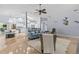 Open concept living room flows to kitchen, bright with blue accents at 2136 Pinnacle N Cir, Palm Harbor, FL 34684