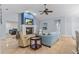 Spacious living room features a fireplace, fan, and neutral decor at 2136 Pinnacle N Cir, Palm Harbor, FL 34684