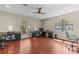 Bright office with natural light, ceiling fan, and hardwood floors creating a professional atmosphere at 2136 Pinnacle N Cir, Palm Harbor, FL 34684