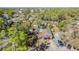 Aerial view of a charming neighborhood showcasing the property's location and surrounding greenery at 2410 E Palifox St, Tampa, FL 33610
