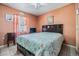 Serene bedroom with a comfortable bed, soft lighting, and neutral tones for a relaxing ambiance at 2410 E Palifox St, Tampa, FL 33610