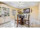 Inviting dining room featuring tile floors and glass-top table at 2410 E Palifox St, Tampa, FL 33610