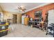 Comfortable living area with brick wall accent and tile flooring throughout at 2410 E Palifox St, Tampa, FL 33610