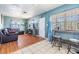 Inviting living room featuring stylish furniture, natural light, and a seamless flooring transition at 2410 E Palifox St, Tampa, FL 33610