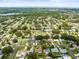 Aerial view of a well-established neighborhood with tree lined streets at 2523 Blackwood Cir, Clearwater, FL 33763