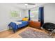 Relaxing bedroom with wood look floors, and natural light at 2523 Blackwood Cir, Clearwater, FL 33763