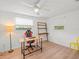 Study with natural light, wood look floors, and ceiling fan at 2523 Blackwood Cir, Clearwater, FL 33763