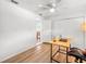 Study with wood look floors, ceiling fan, and adjacent room at 2523 Blackwood Cir, Clearwater, FL 33763