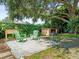 Patio with grill and chairs ready for outdoor living at 2523 Blackwood Cir, Clearwater, FL 33763