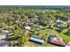 Aerial view of a home with a lush green landscape and surrounding trees at 2903 Oak Crest Dr, Plant City, FL 33565