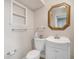 Cozy bathroom featuring a toilet, vanity, and gold trimmed mirror with lots of natural light at 2903 Oak Crest Dr, Plant City, FL 33565