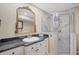 Elegant bathroom featuring granite countertops, white cabinets, and glass door shower at 2903 Oak Crest Dr, Plant City, FL 33565