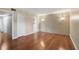Spacious bedroom featuring hardwood floors and a unique textured brick accent wall at 2903 Oak Crest Dr, Plant City, FL 33565
