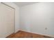 This bedroom has wood floors, a closet, neutral paint, and an electrical outlet at 2903 Oak Crest Dr, Plant City, FL 33565