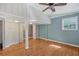 Bedroom with hardwood floors, a ceiling fan, and multiple closets for storage at 2903 Oak Crest Dr, Plant City, FL 33565