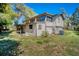 View of the back exterior of the home surrounded by a well-maintained lawn at 2903 Oak Crest Dr, Plant City, FL 33565