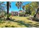 Exterior view of a home with a large yard and mature trees at 2903 Oak Crest Dr, Plant City, FL 33565