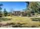 Well-manicured front yard with flourishing plants that enhance the curb appeal of the home at 2903 Oak Crest Dr, Plant City, FL 33565