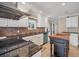 Elegant kitchen featuring granite countertops, tile backsplash and wooden island at 2903 Oak Crest Dr, Plant City, FL 33565