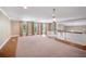 Expansive living room with neutral carpet, bright windows and a grand staircase view at 2903 Oak Crest Dr, Plant City, FL 33565