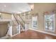 Bright staircase with white railing leads to the second floor, offering natural light at 2903 Oak Crest Dr, Plant City, FL 33565