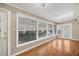 Inviting sun room with hardwood floors and lots of natural light from many windows at 2903 Oak Crest Dr, Plant City, FL 33565