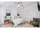 Bright bedroom featuring a ceiling fan, neutral walls, and a closet for ample storage at 311 Poinsettia Rd, Anna Maria, FL 34216