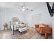 Bright bedroom featuring a ceiling fan, light wood floors, stylish furnishings, rug and closet at 311 Poinsettia Rd, Anna Maria, FL 34216