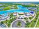 Aerial view of a lagoon featuring white sand beach areas, waterslides, restaurants, and watercraft at 31879 Treasure Dock Isle, Wesley Chapel, FL 33545