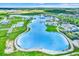Aerial view of a large lagoon with beach areas, water slides, and recreation areas at 31879 Treasure Dock Isle, Wesley Chapel, FL 33545