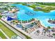 Overhead view of community lagoon featuring sandy beach areas, waterpark, restaurants, and recreation at 31879 Treasure Dock Isle, Wesley Chapel, FL 33545