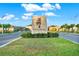 Epperson community entrance featuring palm trees and lush landscaping near modern homes at 31879 Treasure Dock Isle, Wesley Chapel, FL 33545