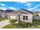 Beautiful single-Gathering home with a lush lawn and stone accents, complemented by a 2 car garage at 31879 Treasure Dock Isle, Wesley Chapel, FL 33545